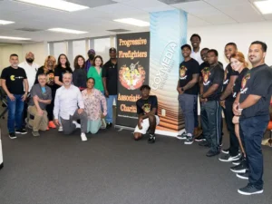 Group photo of PFA members at a location teaching CPR to a group